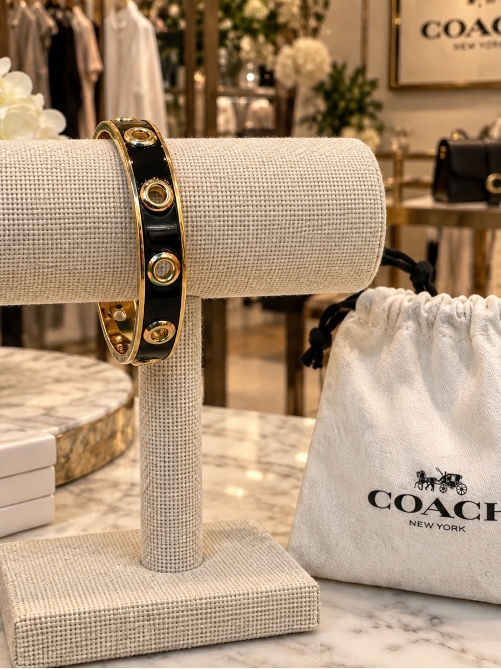 Coach Black and Gold Enamel Bangle Bracelet with Stud Accents